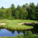 Panoramic view of a lush green golf course at Bretwood Golf Course. Smooth