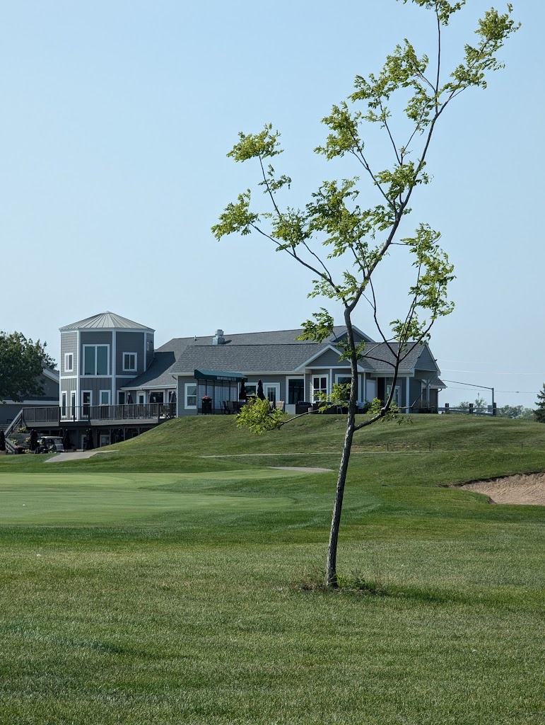Panoramic view of a lush green golf course at Briarwood Golf Club. Smooth