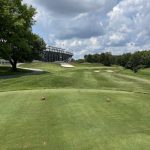 Panoramic view of a lush green golf course at Brickyard Crossing. Smooth