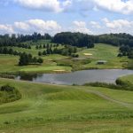 Panoramic view of a lush green golf course at Bridge Haven Golf Course on the Gorge. Smooth