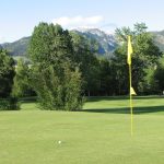 Panoramic view of a lush green golf course at Bridger Creek Golf Course. Smooth
