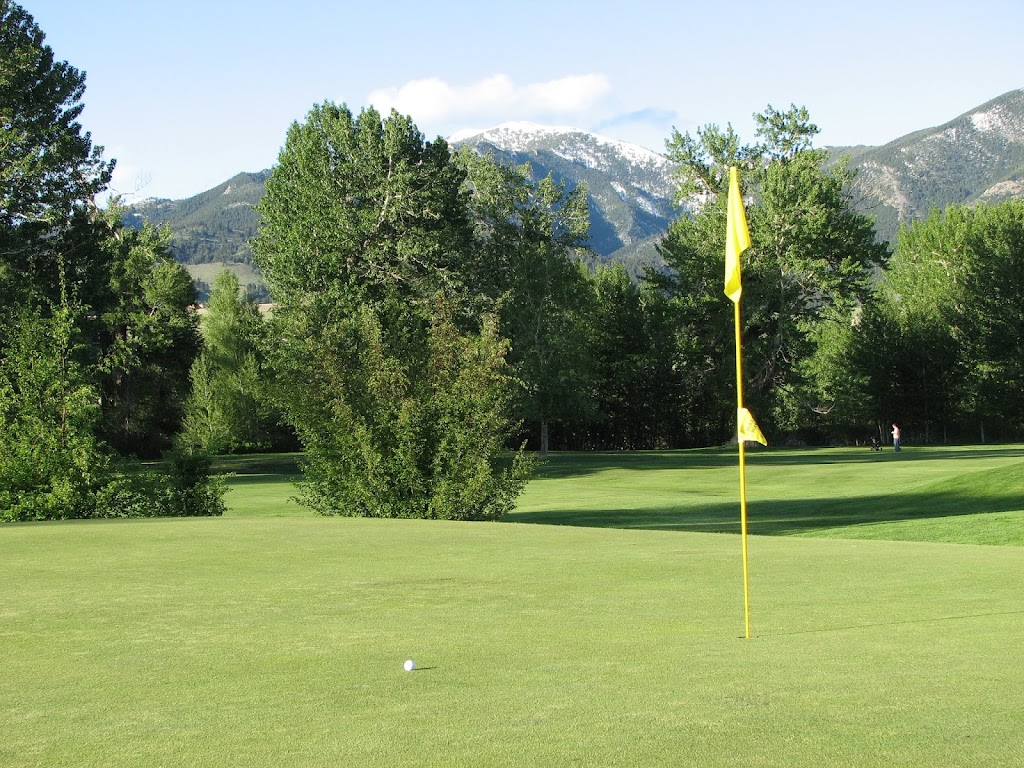 Panoramic view of a lush green golf course at Bridger Creek Golf Course. Smooth