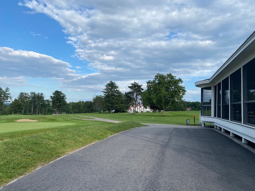 Panoramic view of a lush green golf course at Bridgton Highlands Country Club. Smooth