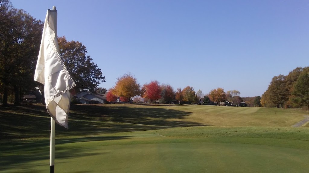 Panoramic view of a lush green golf course at Brittany Golf Course. Smooth