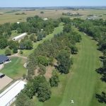 Panoramic view of a lush green golf course at Britton Country Club. Smooth