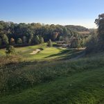Panoramic view of a lush green golf course at Broad Run Golfer's Club. Smooth