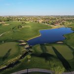 Panoramic view of a lush green golf course at Broadlands Golf Course. Smooth