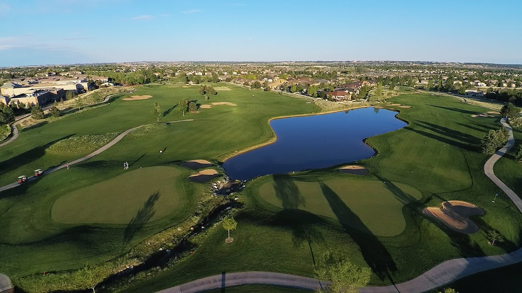 Panoramic view of a lush green golf course at Broadlands Golf Course. Smooth