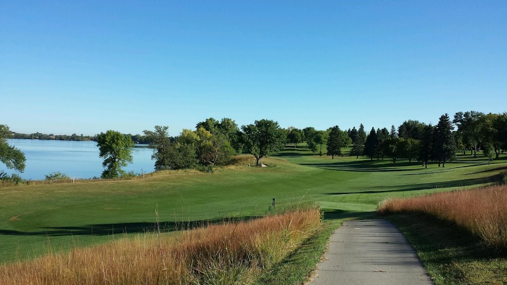 Panoramic view of a lush green golf course at Brookings Country Club. Smooth