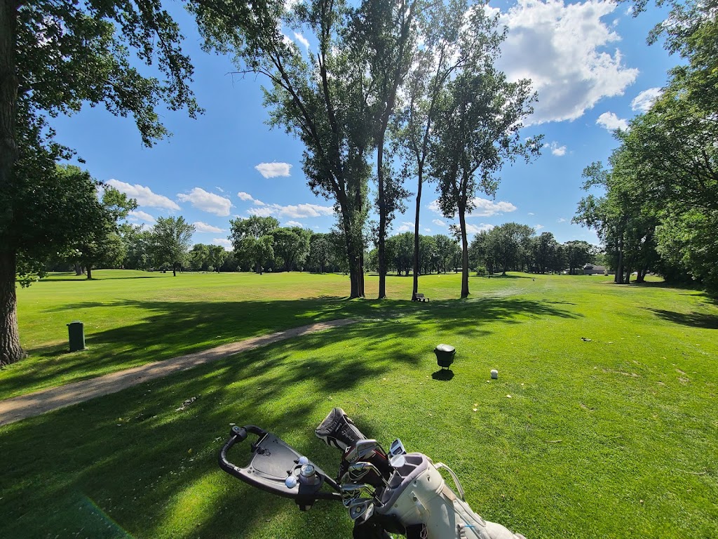 Panoramic view of a lush green golf course at Brookland Golf Park. Smooth