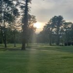Panoramic view of a lush green golf course at Brookmeadow Country Club. Smooth
