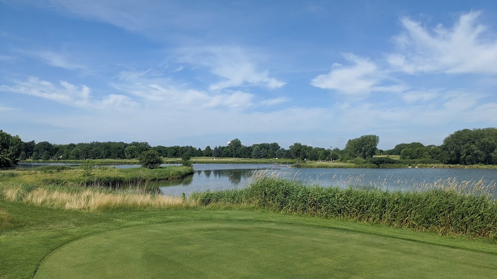 Panoramic view of a lush green golf course at Brooks Golf. Smooth