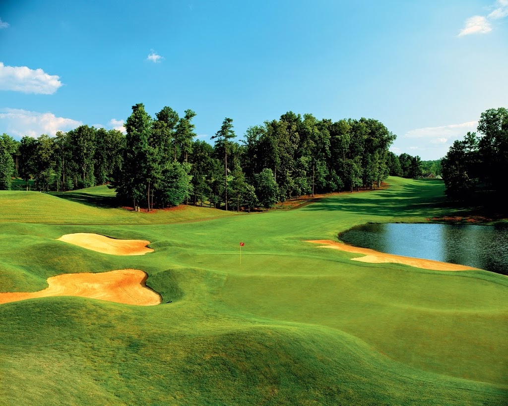 Panoramic view of a lush green golf course at Brookstone Golf & Country Club. Smooth