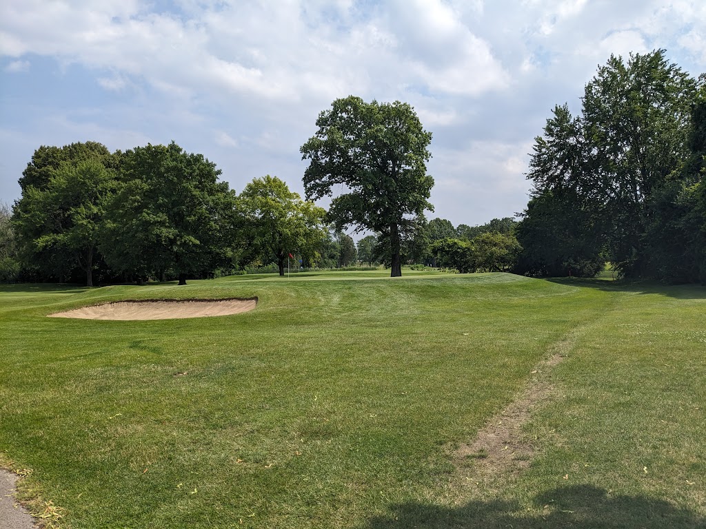 Panoramic view of a lush green golf course at Brown Deer Park Golf Course. Smooth