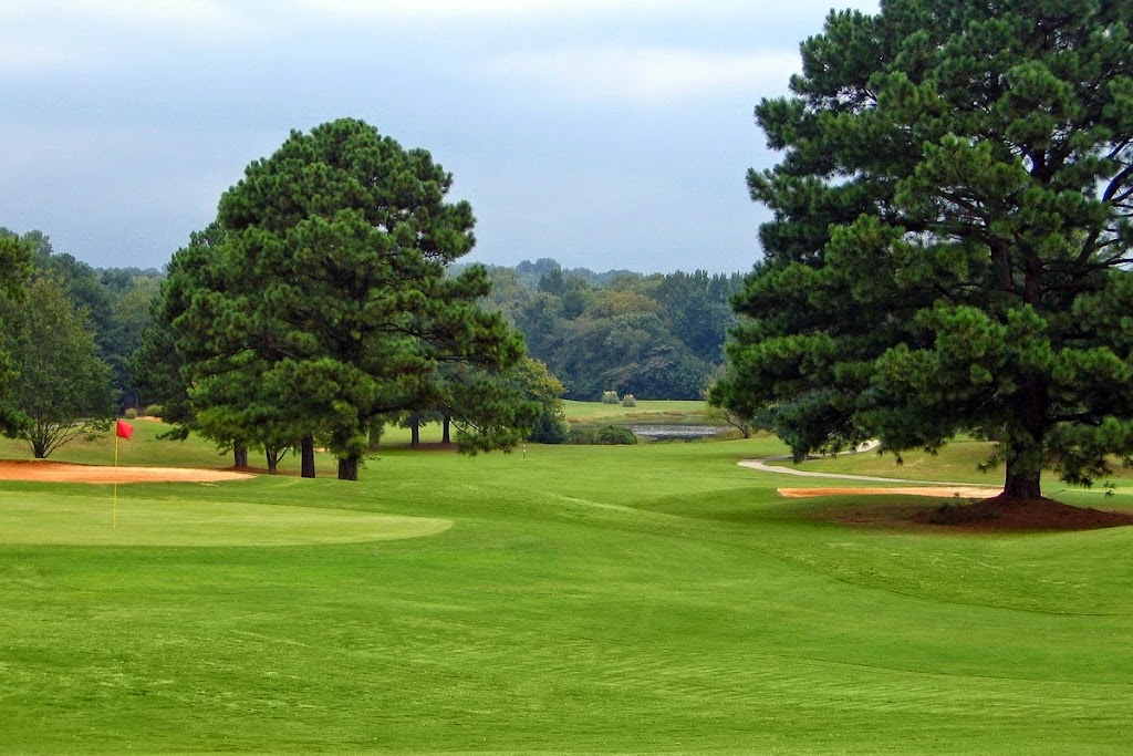 Panoramic view of a lush green golf course at Brown's Mill Golf Course. Smooth