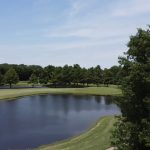 Panoramic view of a lush green golf course at Brownstone Country Club & Resort. Smooth