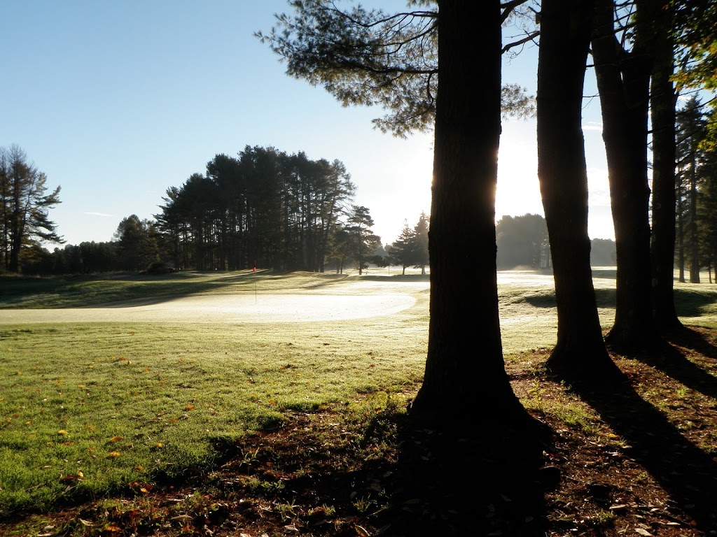 Panoramic view of a lush green golf course at Brunswick Golf Club. Smooth