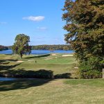 Panoramic view of a lush green golf course at Bryan Park. Smooth