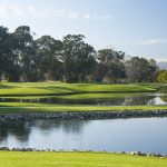 Panoramic view of a lush green golf course at Buenaventura Golf Course. Smooth