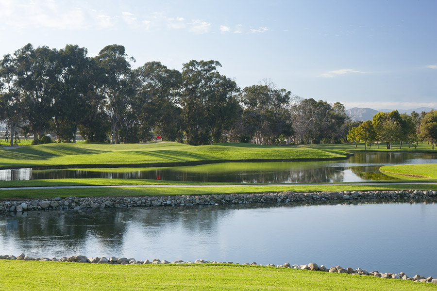 Panoramic view of a lush green golf course at Buenaventura Golf Course. Smooth