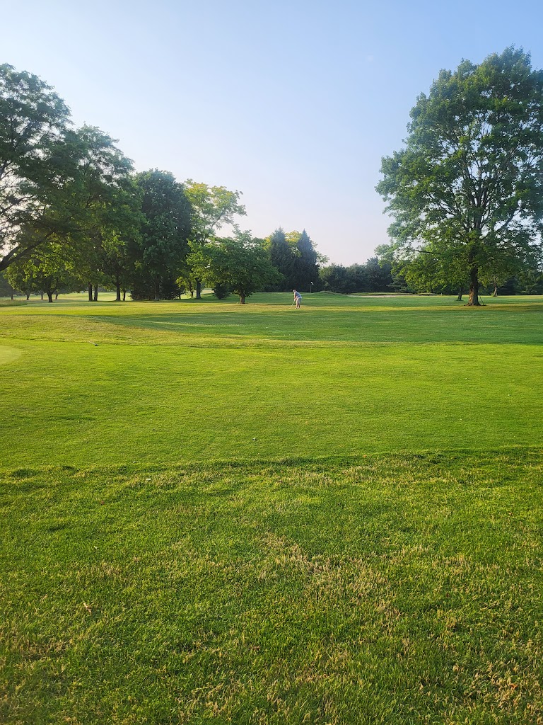 Panoramic view of a lush green golf course at Buffalo Golf Course. Smooth