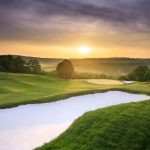 Panoramic view of a lush green golf course at Buffalo Ridge Springs Golf Course. Smooth