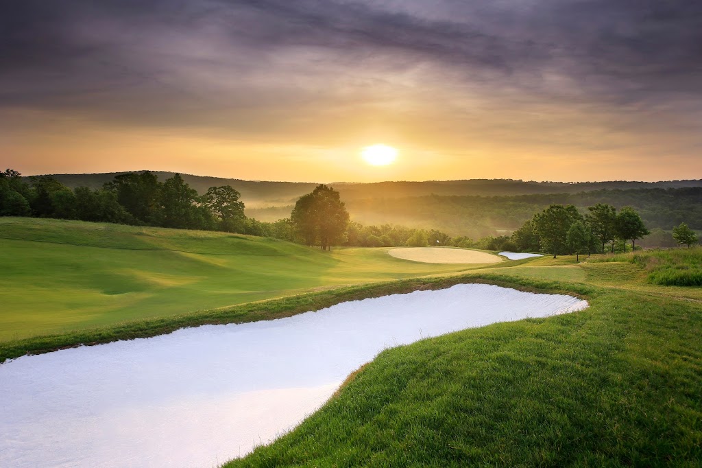 Panoramic view of a lush green golf course at Buffalo Ridge Springs Golf Course. Smooth