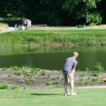 green grass with the flag in the hole.