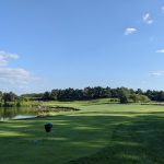 Panoramic view of a lush green golf course at Buffer Park Golf Course. Smooth