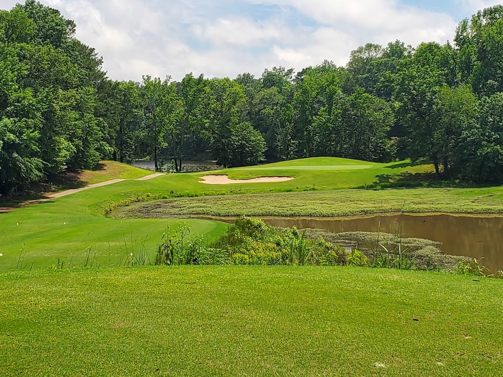 Panoramic view of a lush green golf course at Bull Creek Golf Course. Smooth