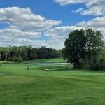 Panoramic view of a lush green golf course at Bull Run Golf Club. Smooth