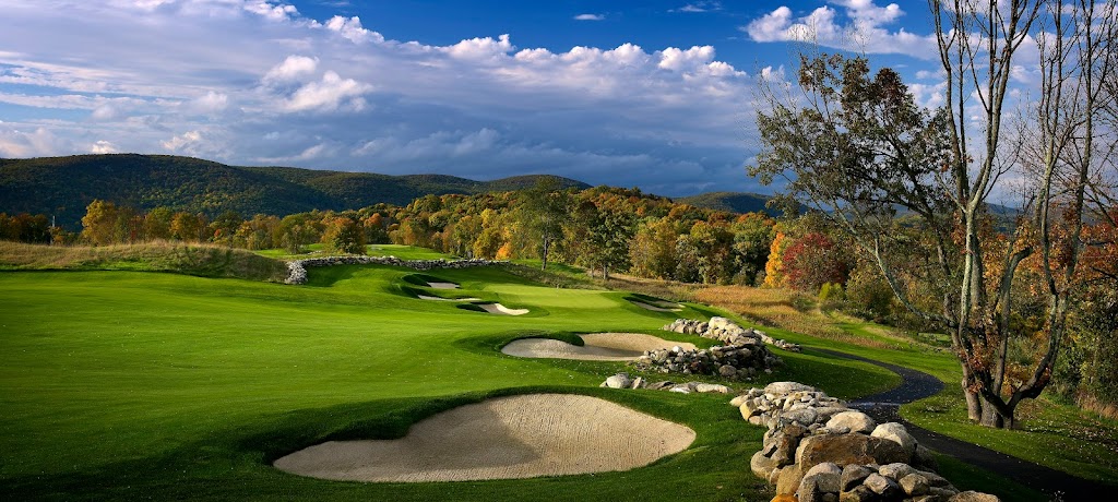 Panoramic view of a lush green golf course at Bull's Bridge Golf Club. Smooth