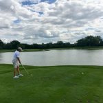 green grass with the flag in the hole.