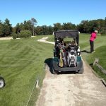 green grass with the flag in the hole.