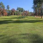 Panoramic view of a lush green golf course at Butter Brook Golf Club. Smooth