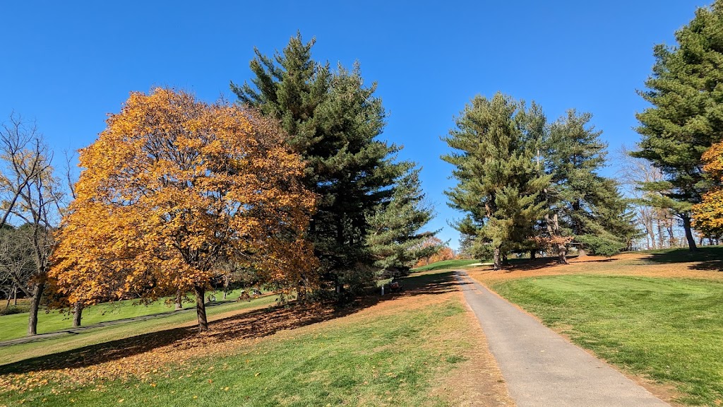 Panoramic view of a lush green golf course at Butter Valley Golf Course. Smooth