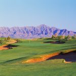 Panoramic view of a lush green golf course at Butterfield Trail Golf Club. Smooth