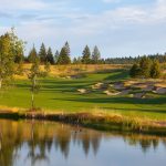 Panoramic view of a lush green golf course at CDA National Reserve Private Club and Golf Course. Smooth