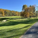 Panoramic view of a lush green golf course at Cacapon Golf Club. Smooth