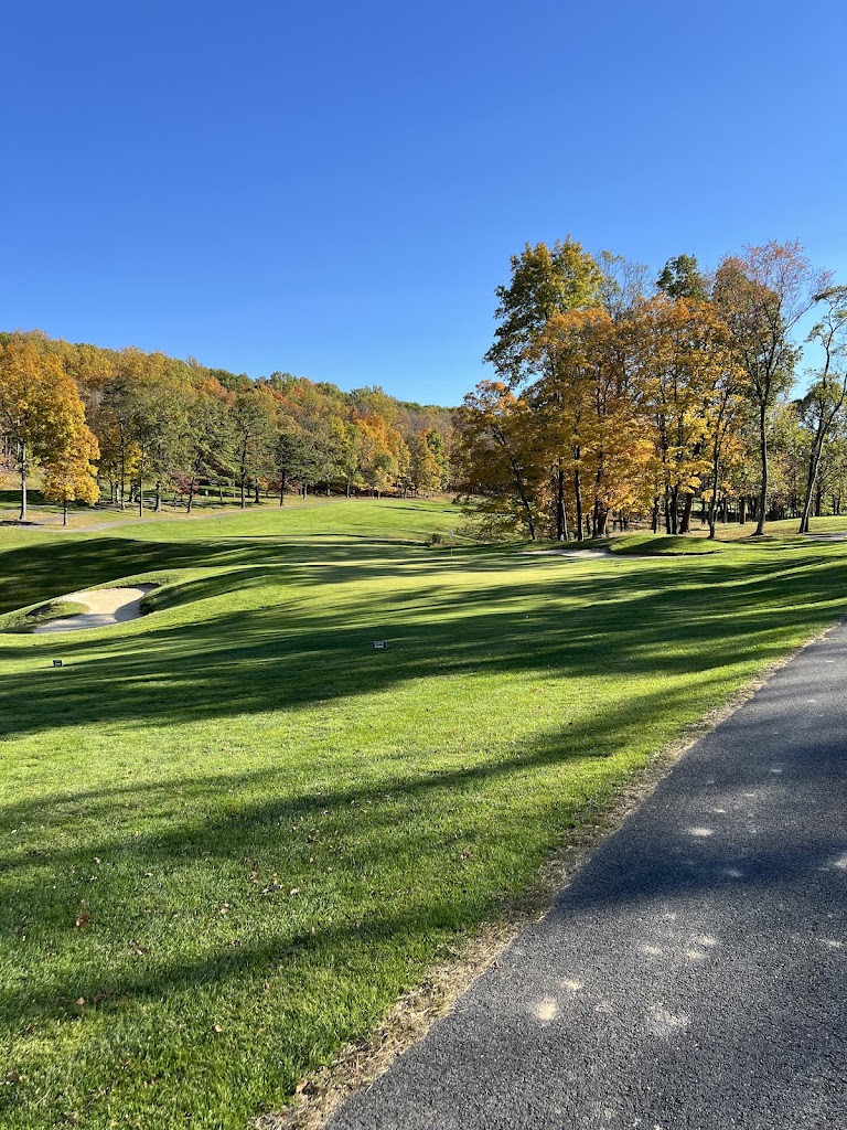 Panoramic view of a lush green golf course at Cacapon Golf Club. Smooth