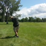 green grass with the flag in the hole.