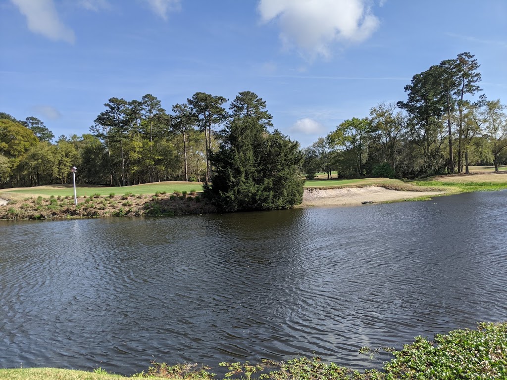 Panoramic view of a lush green golf course at Caledonia Golf & Fish Club. Smooth