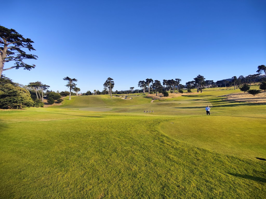 Panoramic view of a lush green golf course at California Golf Club of San Francisco. Smooth