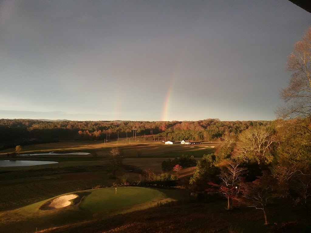 Panoramic view of a lush green golf course at Callahan Golf Links. Smooth