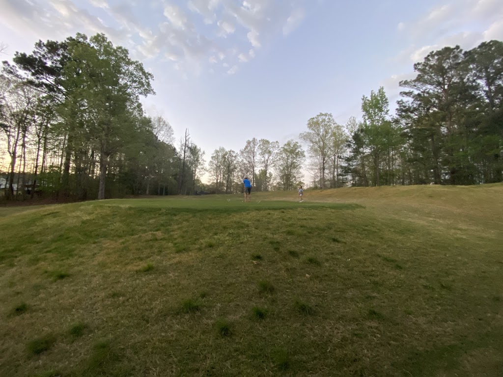 Panoramic view of a lush green golf course at Calvert Crossing Golf Club.. Smooth
