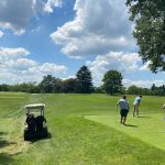 Panoramic view of a lush green golf course at Camargo Club. Smooth