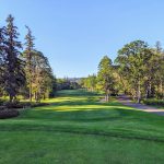 Panoramic view of a lush green golf course at Camas Meadows Golf Club. Smooth