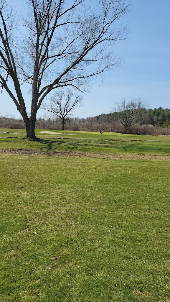 Panoramic view of a lush green golf course at Canaan Country Club and The Belted Cow. Smooth