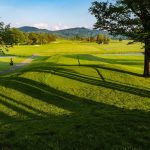 Panoramic view of a lush green golf course at Canaan Valley Resort Golf Club. Smooth