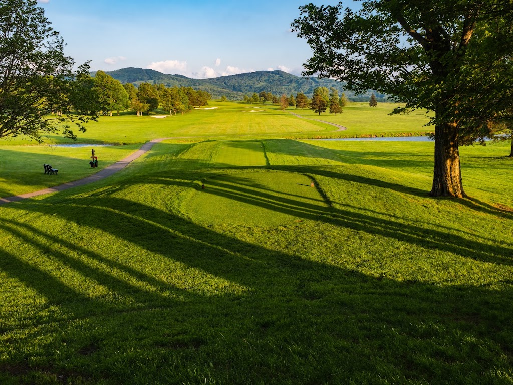 Panoramic view of a lush green golf course at Canaan Valley Resort Golf Club. Smooth